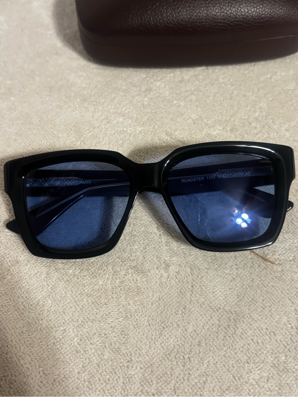 Jean LaFont Roadster
Black Square-Frame Sunglasses with Blue Lenses size 57/17